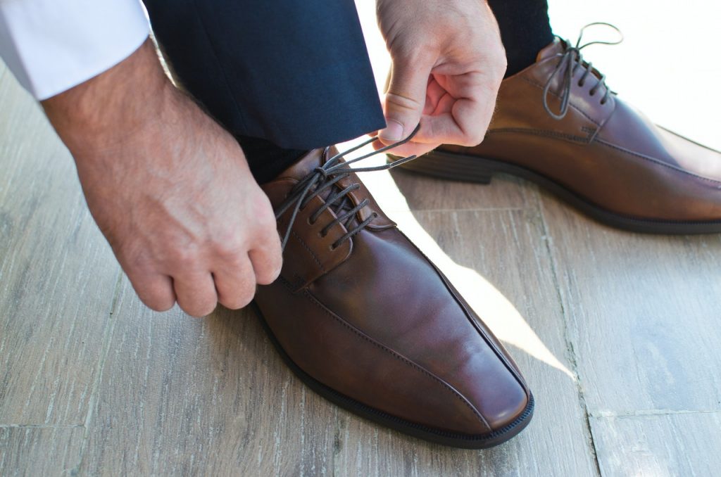 close up of a man wearing shoes